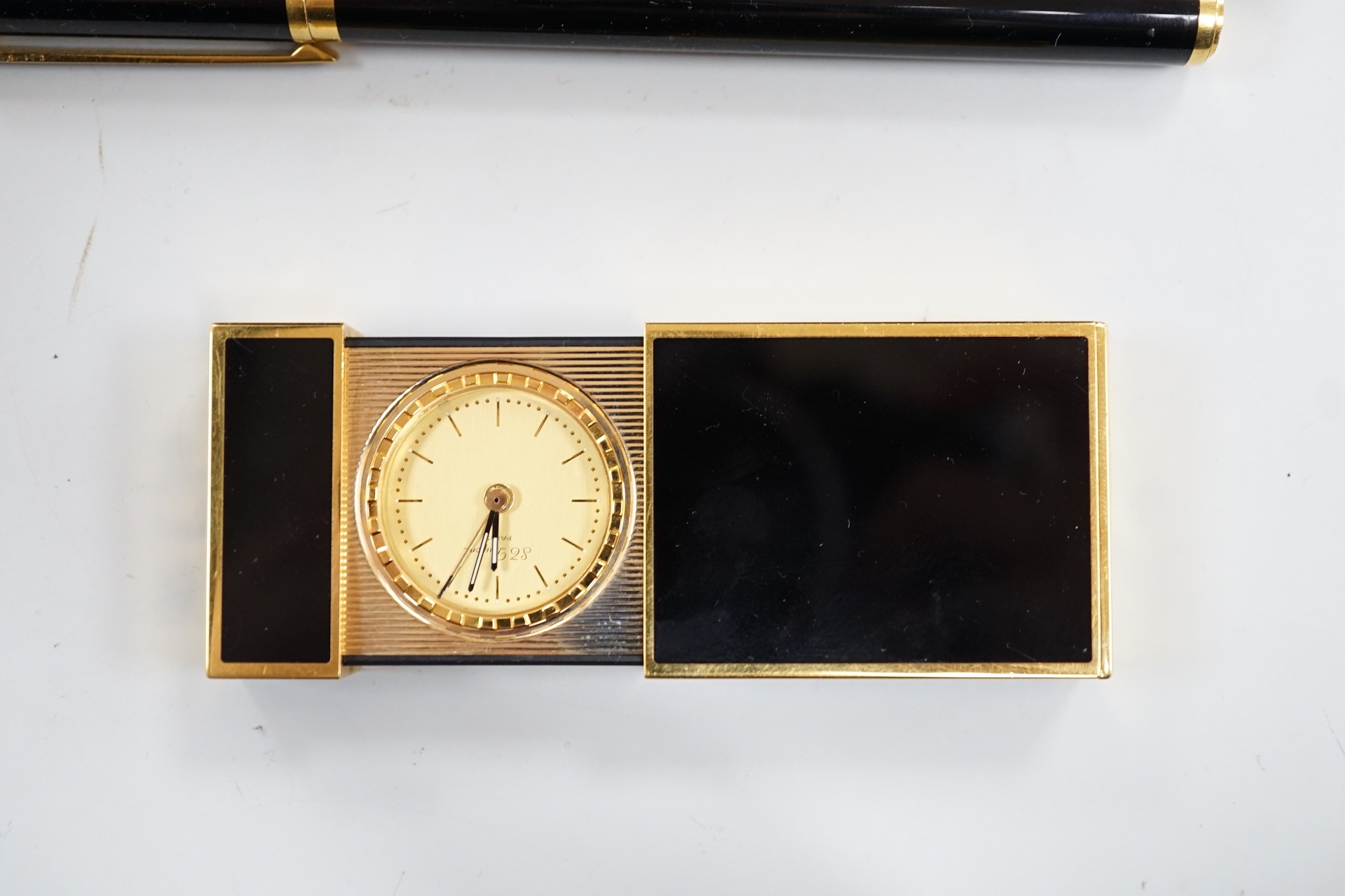 A cased Dunhill fountain pen, a Dupont travelling time piece and fountain pen